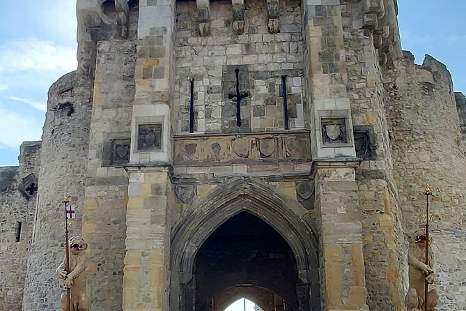 The north face of the Bargate in Southampton, its shields and arrow slits above the arch