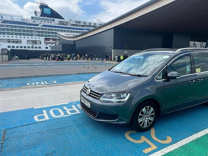 The marked drop-off bay outside a Southampton cruise terminal, a liner behind it